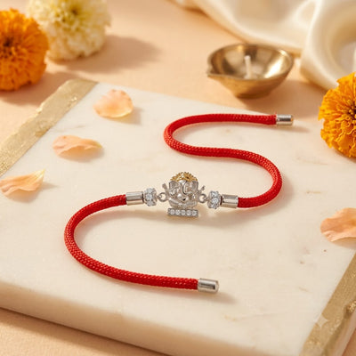 Silver Ganesh Rakhi with Red Thread