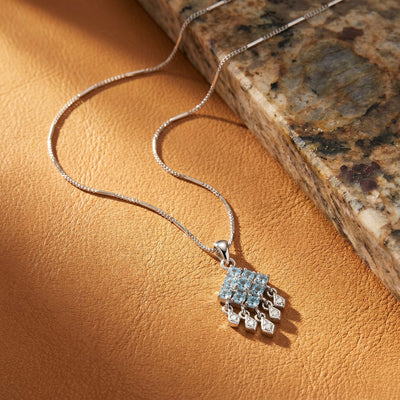 Blue Topaz and White Stone Floral Pendant