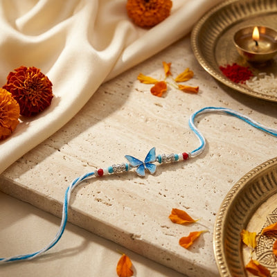 Blue Butterfly Silver Rakhi – Elegant Floral Beaded Rakhi