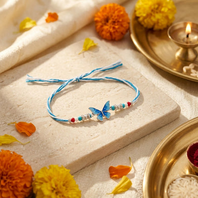 Blue Butterfly Silver Rakhi – Elegant Floral Beaded Rakhi