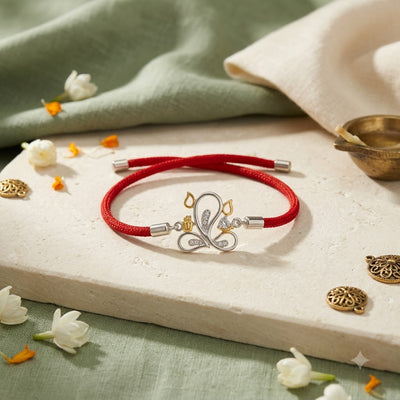 Silver Peacock Rakhi with Red Thread